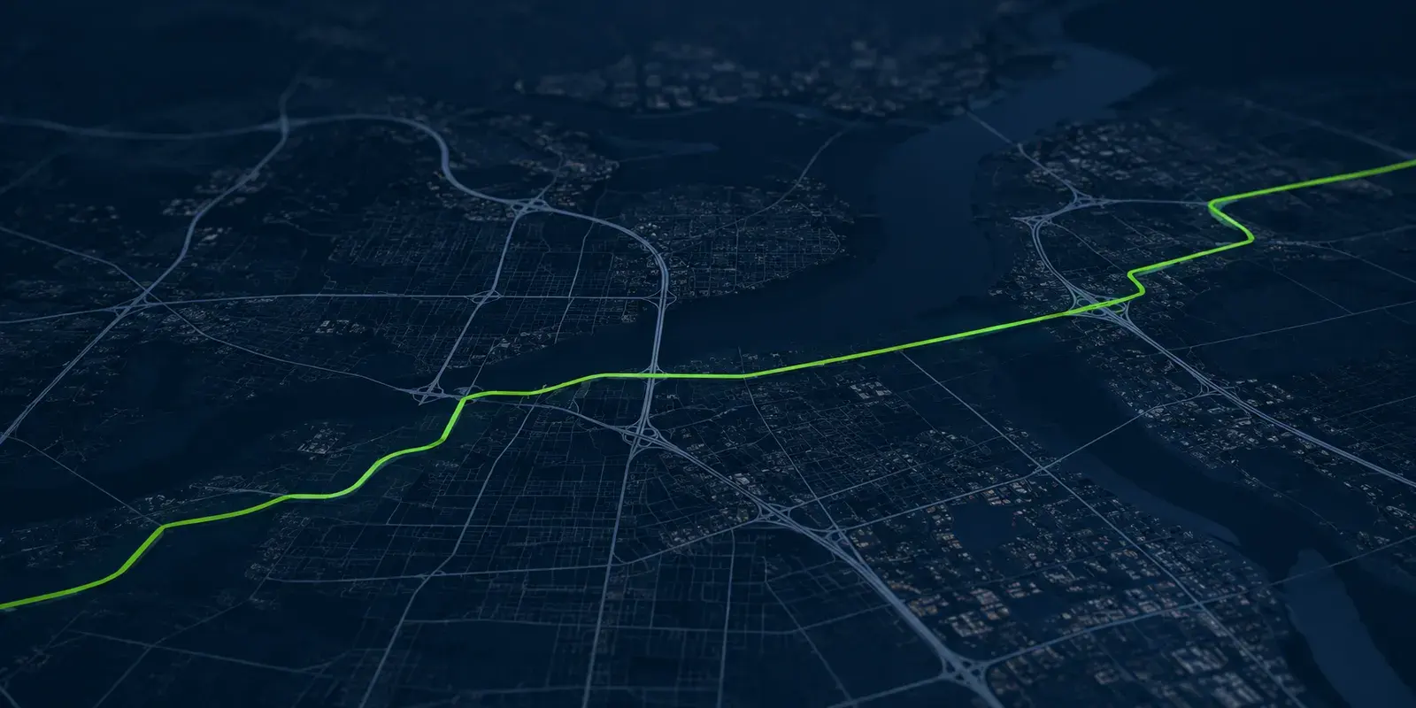 A freight route traced across a city map at night